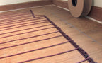 tempzone floor heating cable installed over wood floor