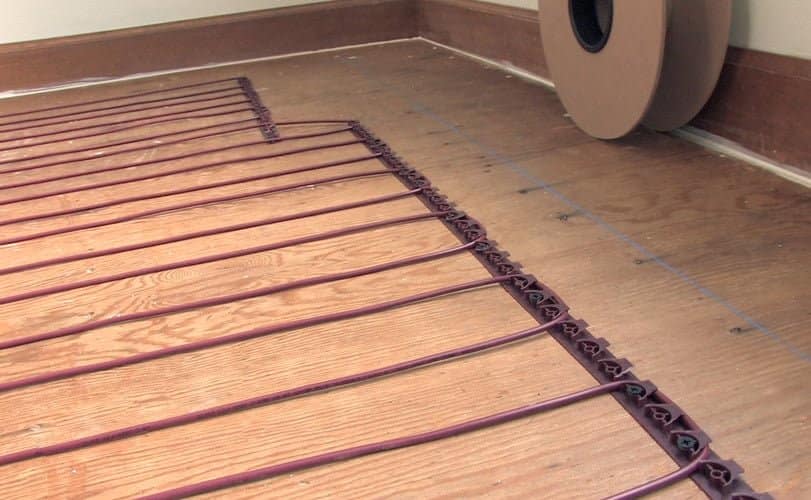 tempzone floor heating cable installed over wood floor